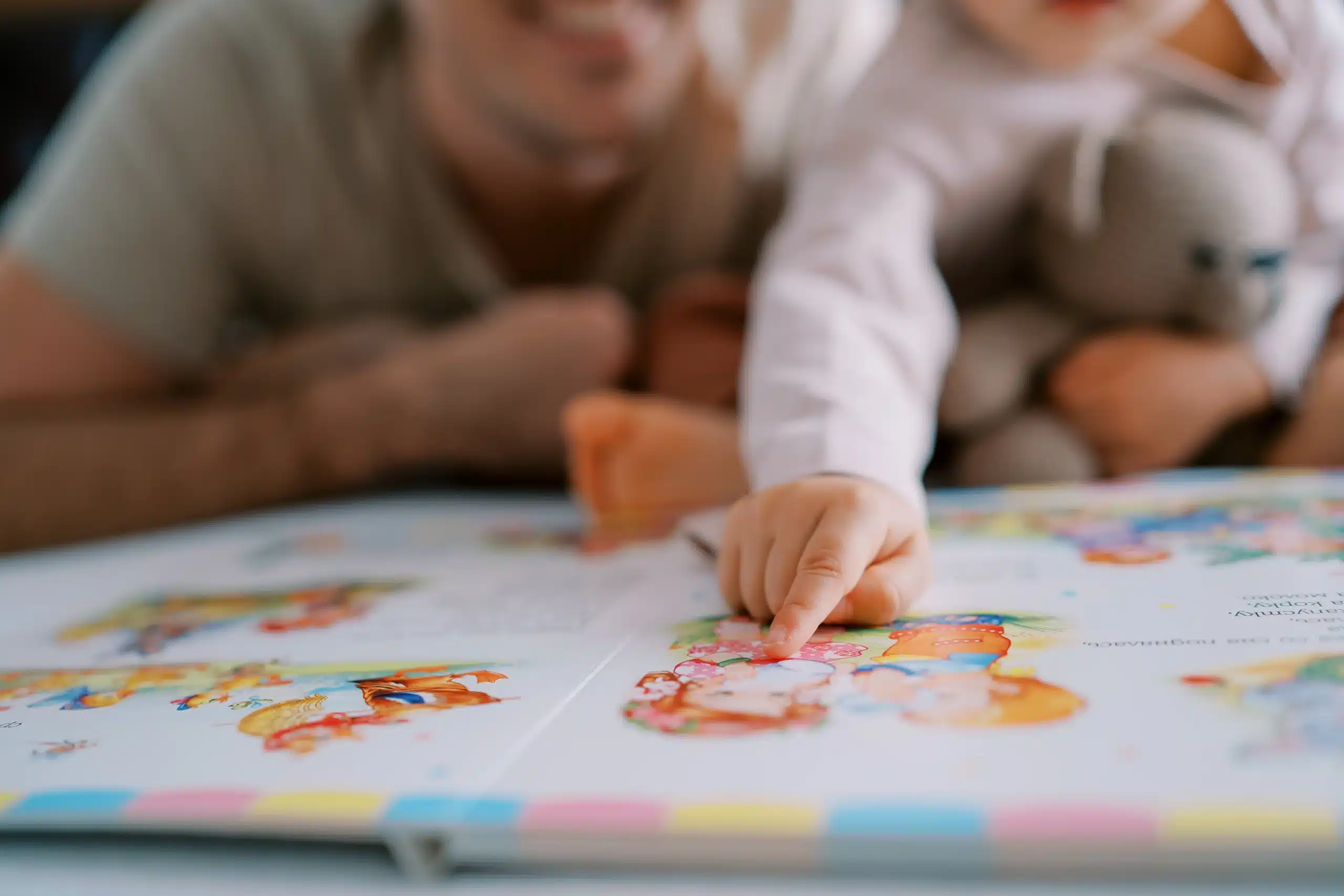 vecteezy little girl points her finger at a colorful picture in a 59006427 scaled
